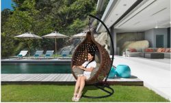 Brown rattan hanging swing chair